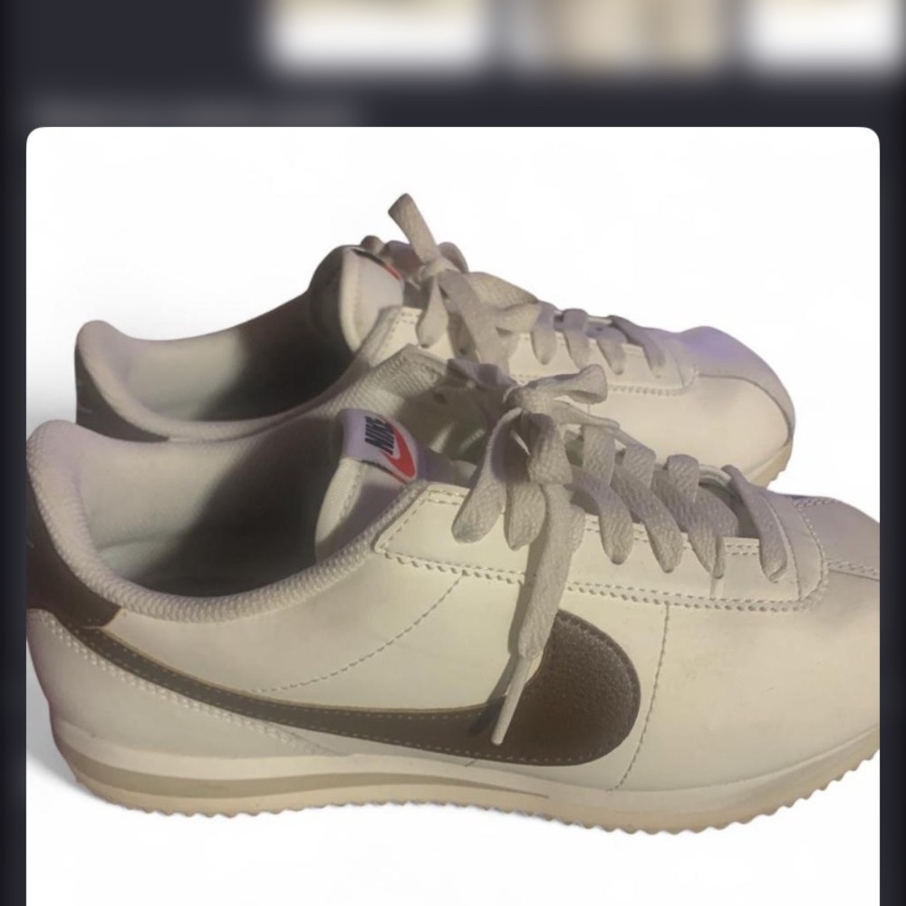 Nike light cream colored Sneakers with Brown Swoosh